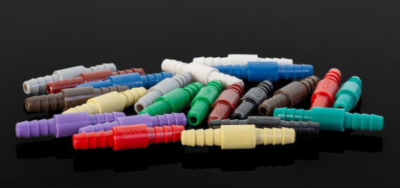 Different colored pipes with a black background